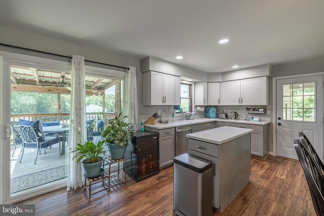 7208 Kirtley Trl, Culpeper, VA 22701 - kitchen featuring stainless steel dishwasher, light countertops, a center island, dark wood-style flooring, and recessed lighting