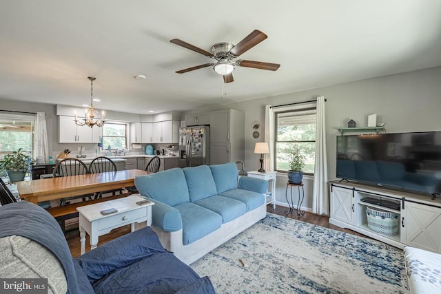 7208 Kirtley Trl, Culpeper, VA 22701 - living area featuring a chandelier, a ceiling fan, and dark wood-style flooring