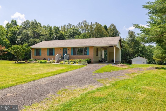 7208 Kirtley Trl, Culpeper, VA 22701 - ranch-style house featuring a front yard, gravel driveway, an outdoor structure, a garage, and view of scattered trees