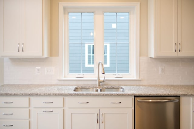 2892 Rutlege Rd Unit 177, Rockingham, VA 22801 - kitchen with a sink, stainless steel dishwasher, decorative backsplash, and white cabinets