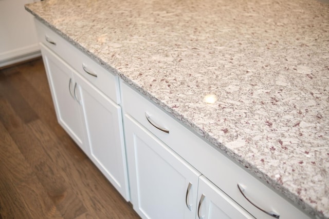 2892 Rutlege Rd Unit 177, Rockingham, VA 22801 - details with light stone countertops, dark wood-style floors, and white cabinets