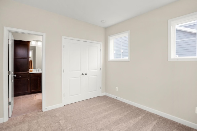 2892 Rutlege Rd Unit 177, Rockingham, VA 22801 - unfurnished bedroom featuring light colored carpet, a closet, and connected bathroom