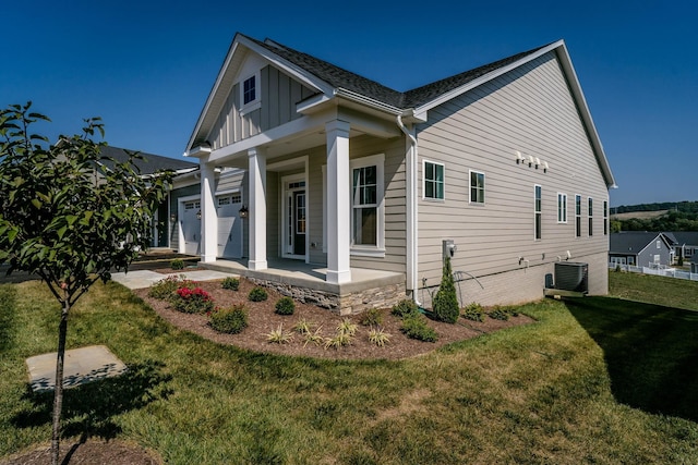 2892 Rutlege Rd Unit 177, Rockingham, VA 22801 - view of side of property featuring a lawn, board and batten siding, a garage, ac unit, and a porch