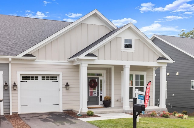 2892 Rutlege Rd Unit 177, Rockingham, VA 22801 - view of front of home featuring board and batten siding, a shingled roof, a garage, and driveway