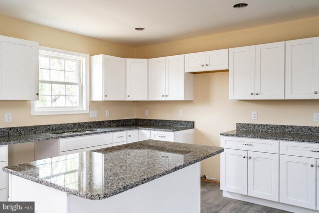 407 Leola Loop, Stanley, VA 22851 - kitchen featuring dark stone counters, white cabinets, wood finished floors, and recessed lighting