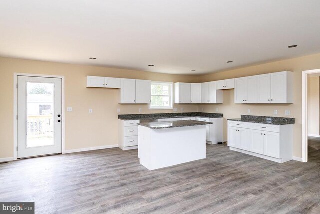 407 Leola Loop, Stanley, VA 22851 - kitchen featuring a kitchen island, white cabinets, light wood-type flooring, baseboards, and recessed lighting