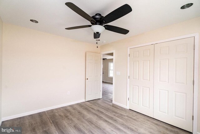 407 Leola Loop, Stanley, VA 22851 - unfurnished bedroom with wood finished floors, baseboards, a closet, and ceiling fan