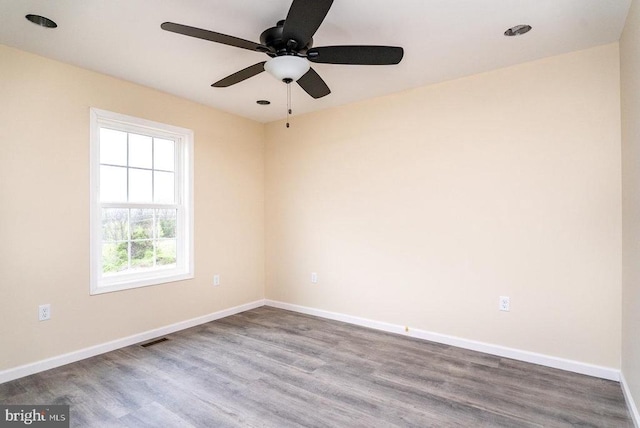 407 Leola Loop, Stanley, VA 22851 - spare room featuring wood finished floors, a ceiling fan, and baseboards