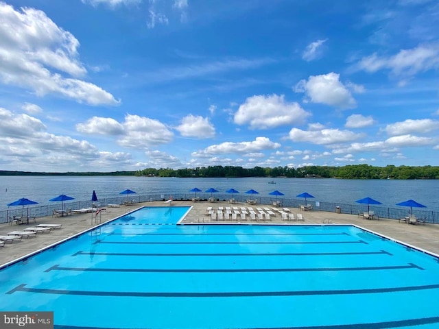 11208 Valor Bridge Dr, Spotsylvania, VA 22551 - community pool with a water view, a patio area, and fence
