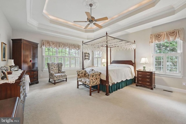 11208 Valor Bridge Dr, Spotsylvania, VA 22551 - bedroom with baseboards, visible vents, crown molding, a raised ceiling, and light carpet