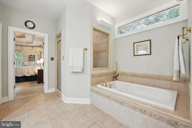 11208 Valor Bridge Dr, Spotsylvania, VA 22551 - full bath featuring a stall shower, tile patterned floors, a bath, baseboards, and ensuite bath