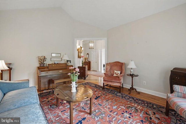 11208 Valor Bridge Dr, Spotsylvania, VA 22551 - living room featuring lofted ceiling, baseboards, and wood finished floors