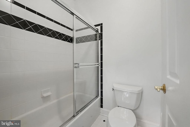 11208 Valor Bridge Dr, Spotsylvania, VA 22551 - full bathroom with toilet, baseboards, and combined bath / shower with glass door