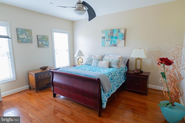 32314 Deep Meadow Ln, Locust Grove, VA 22508 - bedroom featuring multiple windows, wood finished floors, baseboards, and ceiling fan
