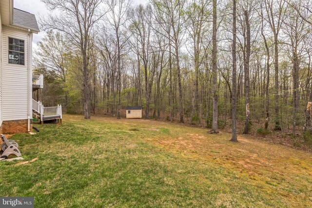 32314 Deep Meadow Ln, Locust Grove, VA 22508 - view of grassy yard featuring a storage unit and an outdoor structure