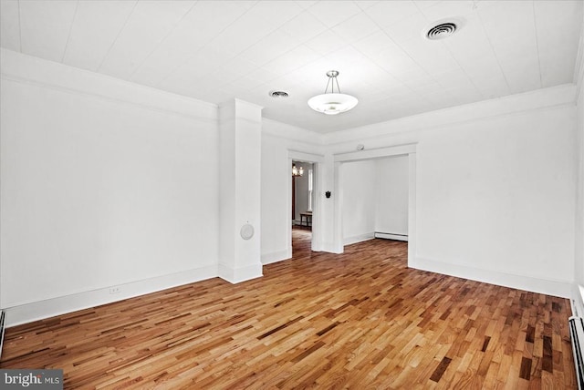 9309 Old Tpke, Culpeper, VA 22701 - empty room with light wood-type flooring and a baseboard radiator