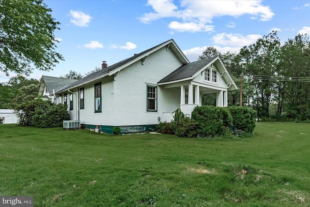 9309 Old Tpke, Culpeper, VA 22701 - view of side of property with a lawn, stucco siding, a chimney, and roof with shingles