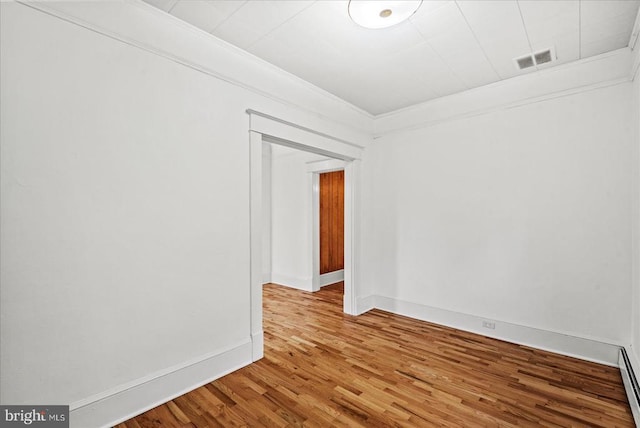 9309 Old Tpke, Culpeper, VA 22701 - unfurnished room with wood finished floors, a baseboard radiator, and ornamental molding
