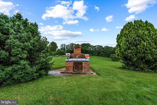 9309 Old Tpke, Culpeper, VA 22701 - view of grassy yard with an outdoor brick fireplace