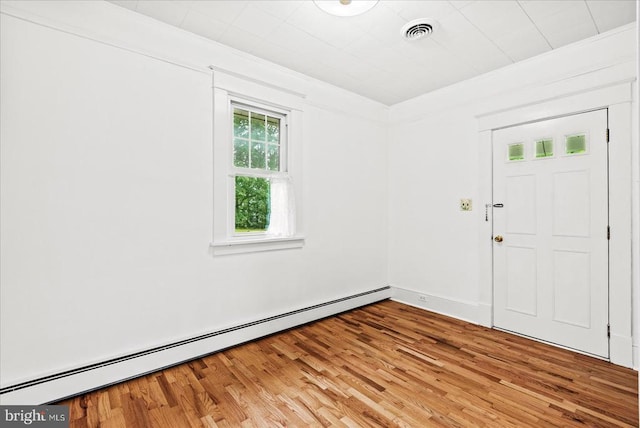 9309 Old Tpke, Culpeper, VA 22701 - unfurnished room with a baseboard radiator and light wood finished floors