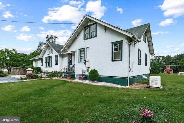 9309 Old Tpke, Culpeper, VA 22701 - view of front of house featuring stucco siding, a front yard, and a shingled roof