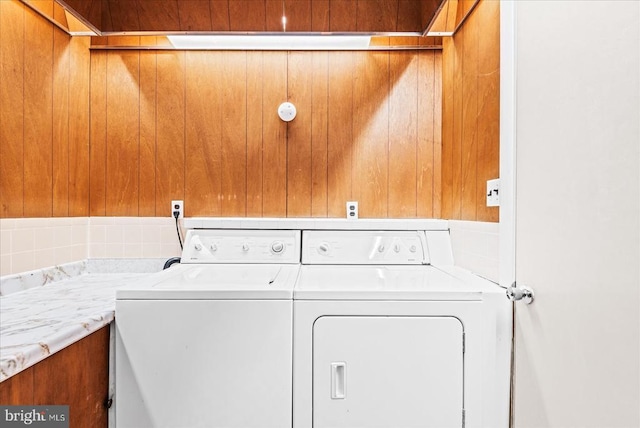 9309 Old Tpke, Culpeper, VA 22701 - laundry area featuring wooden walls and washing machine and clothes dryer