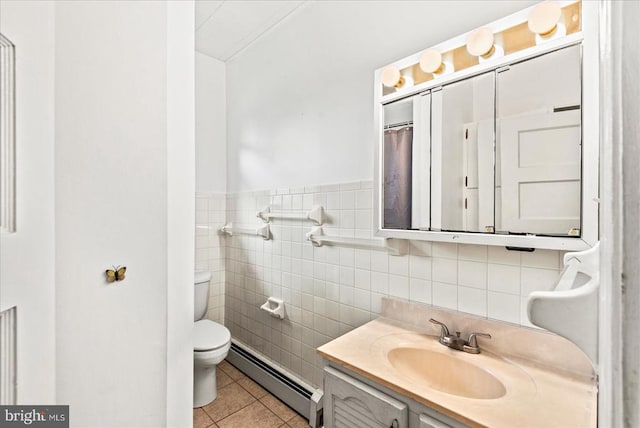 9309 Old Tpke, Culpeper, VA 22701 - full bathroom featuring baseboard heating, tile patterned flooring, vanity, and tile walls