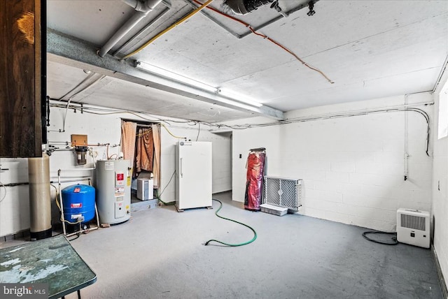 9309 Old Tpke, Culpeper, VA 22701 - unfinished below grade area with electric water heater, a water pressure tank, white refrigerator, and concrete block wall
