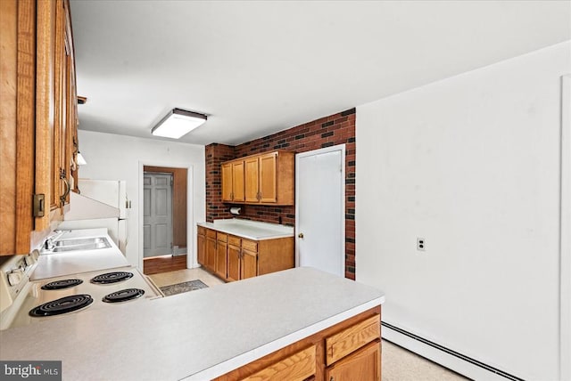 9309 Old Tpke, Culpeper, VA 22701 - kitchen with a baseboard radiator, electric range, light countertops, fridge, and brown cabinets