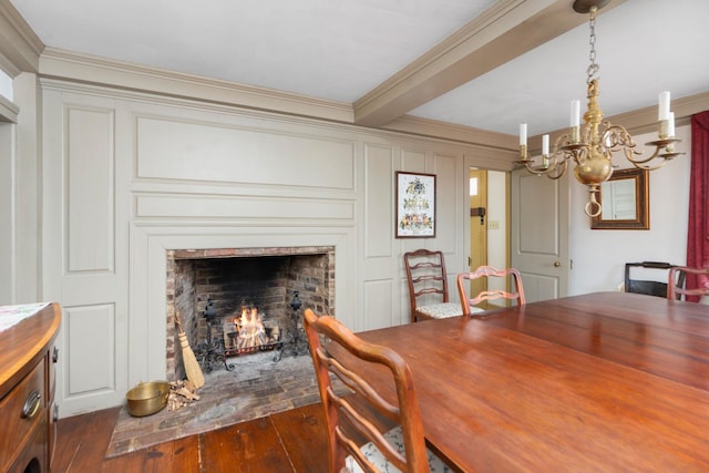 145 Fort Defiance Rd, Fort Defiance, VA 24437 - dining area featuring dark wood-type flooring, ornamental molding, a chandelier, a lit fireplace, and a decorative wall