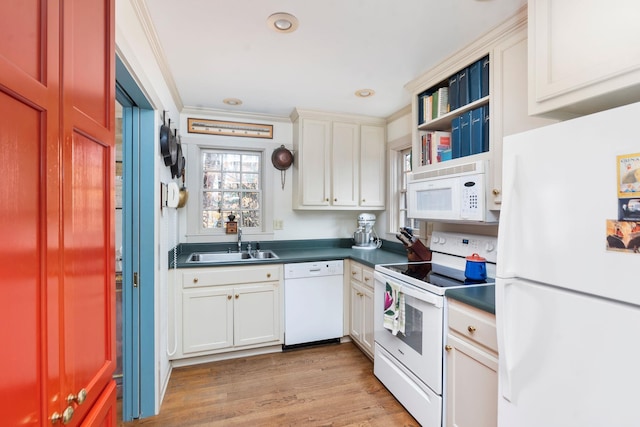 145 Fort Defiance Rd, Fort Defiance, VA 24437 - kitchen with white appliances, dark countertops, a sink, light wood-type flooring, and white cabinets