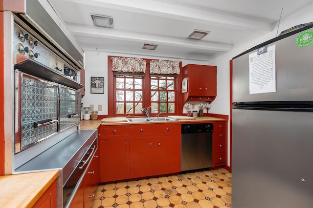 145 Fort Defiance Rd, Fort Defiance, VA 24437 - kitchen featuring appliances with stainless steel finishes, a sink, beamed ceiling, red cabinetry, and light countertops