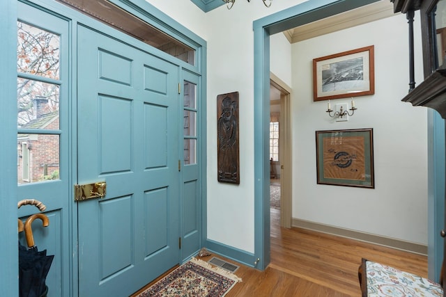 145 Fort Defiance Rd, Fort Defiance, VA 24437 - entryway with light wood finished floors, baseboards, and crown molding
