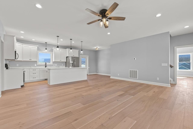 14758 Green View Dr, Elkton, VA 22827 - kitchen with stainless steel appliances, recessed lighting, light countertops, a center island, and ceiling fan