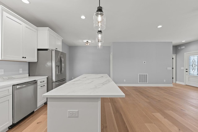 14758 Green View Dr, Elkton, VA 22827 - kitchen with appliances with stainless steel finishes, a center island, white cabinets, pendant lighting, and recessed lighting