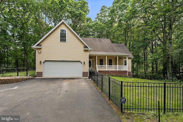 10614 Rhoads Dr, Fredericksburg, VA 22407 - view of front of house featuring a porch, asphalt driveway, and an attached garage