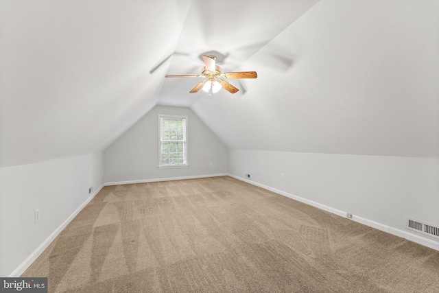 10614 Rhoads Dr, Fredericksburg, VA 22407 - additional living space featuring baseboards, a ceiling fan, vaulted ceiling, and carpet flooring