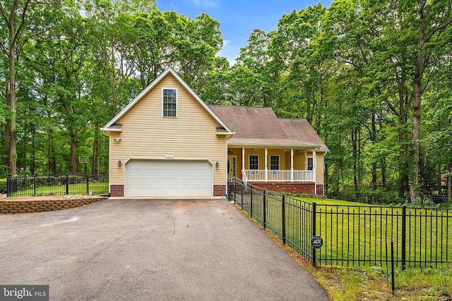 10614 Rhoads Dr, Fredericksburg, VA 22407 - view of front of house with asphalt driveway, a porch, and a garage