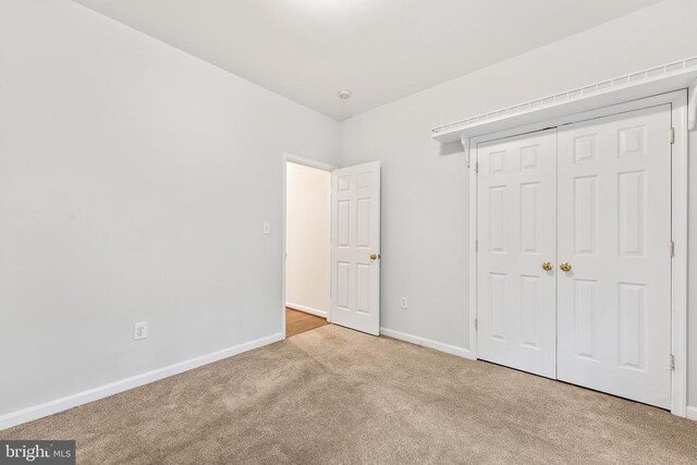 10614 Rhoads Dr, Fredericksburg, VA 22407 - unfurnished bedroom with carpet flooring, baseboards, and a closet