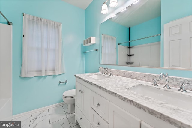 10614 Rhoads Dr, Fredericksburg, VA 22407 - full bathroom with toilet, baseboards, double vanity, marble look tile flooring, and a shower