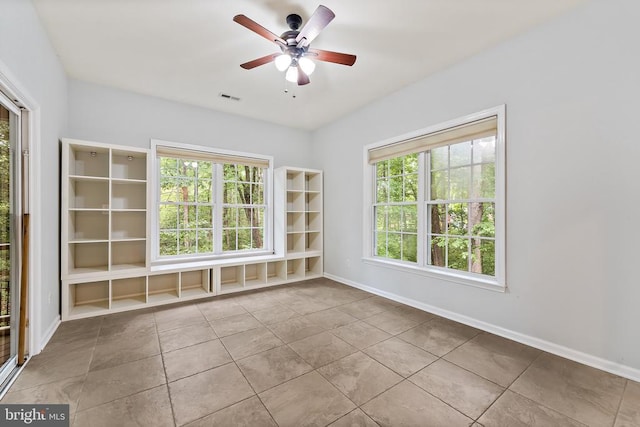 10614 Rhoads Dr, Fredericksburg, VA 22407 - unfurnished room with plenty of natural light, ceiling fan, baseboards, and tile patterned floors