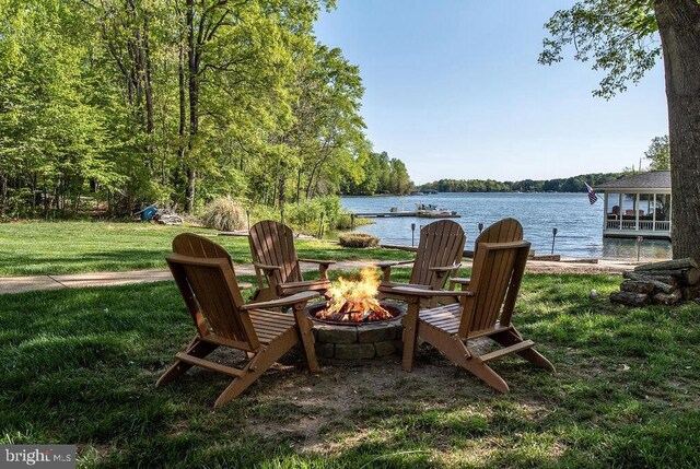 326 Anna Highview, Bumpass, VA 23024 - view of green lawn with a fire pit, a water view, and a view of trees