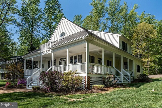 326 Anna Highview, Bumpass, VA 23024 - country-style home featuring a porch, a front yard, a ceiling fan, and stairs