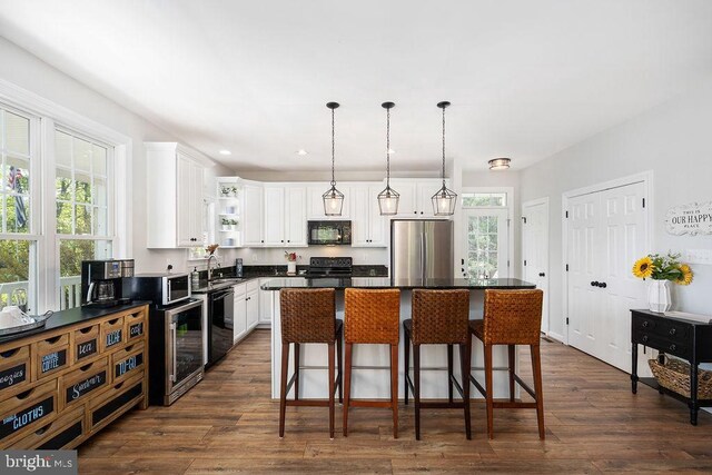 326 Anna Highview, Bumpass, VA 23024 - kitchen featuring black appliances, dark countertops, a sink, dark wood-style floors, and recessed lighting