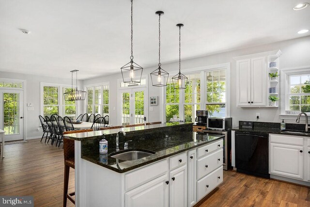 326 Anna Highview, Bumpass, VA 23024 - kitchen featuring black dishwasher, a sink, stainless steel microwave, a kitchen island with sink, and recessed lighting