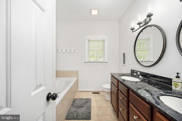 326 Anna Highview, Bumpass, VA 23024 - bathroom with tile patterned floors, a relaxing tiled tub, double vanity, baseboards, and toilet