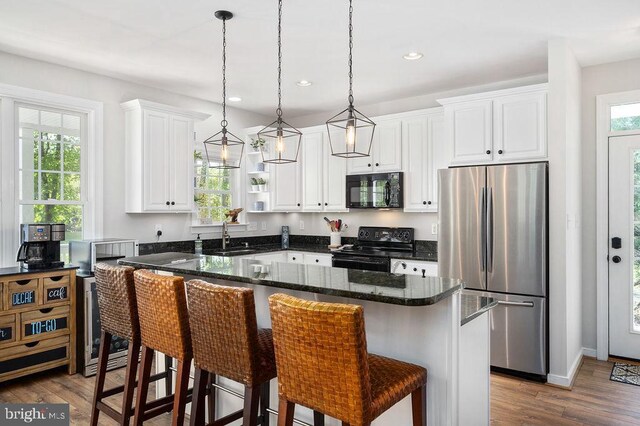 326 Anna Highview, Bumpass, VA 23024 - kitchen featuring black appliances, dark wood-style floors, white cabinetry, a breakfast bar area, and a sink