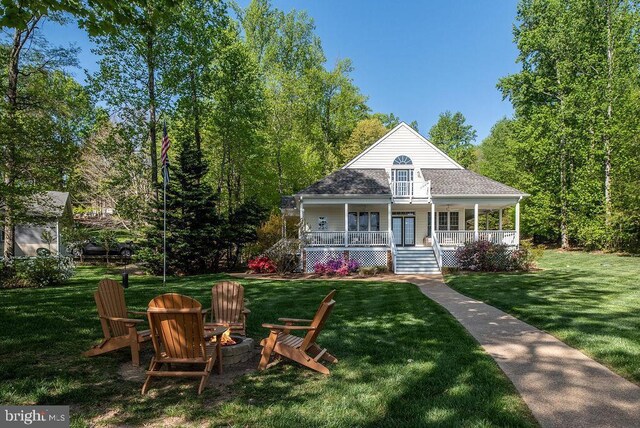 326 Anna Highview, Bumpass, VA 23024 - view of front of home with a porch, an outdoor fire pit, and a front yard
