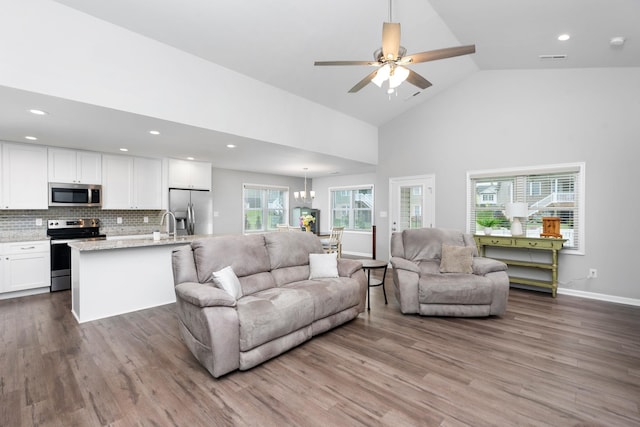 133 Lake View Cir, Waynesboro, VA 22980 - living area featuring wood finished floors, high vaulted ceiling, recessed lighting, a ceiling fan, and a chandelier