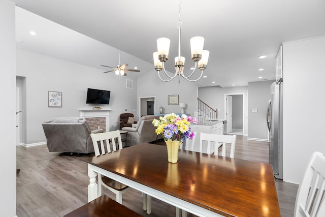 133 Lake View Cir, Waynesboro, VA 22980 - dining space featuring wood finished floors, ceiling fan, a chandelier, recessed lighting, and stairway